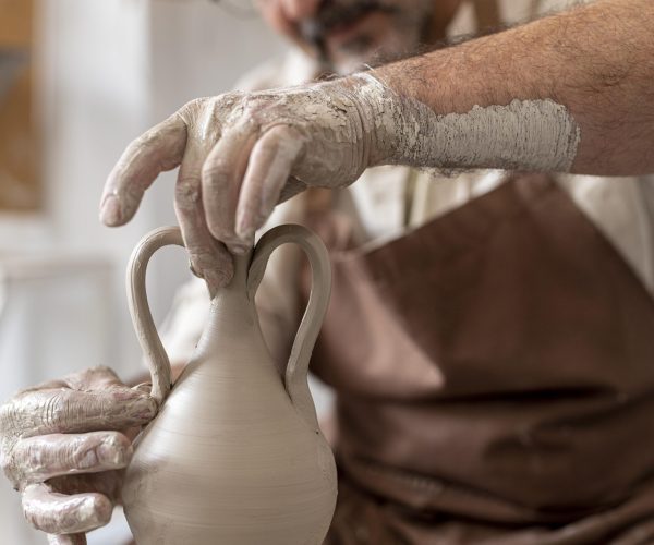 close-up-hands-doing-pottery close-up-hands-doing-pottery
